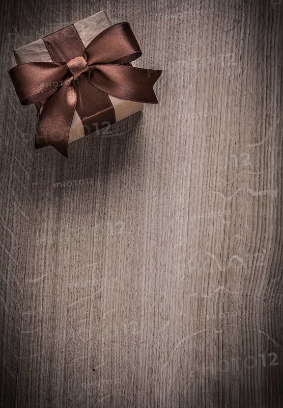 Vintage present box on wooden board holiday concept copyspace