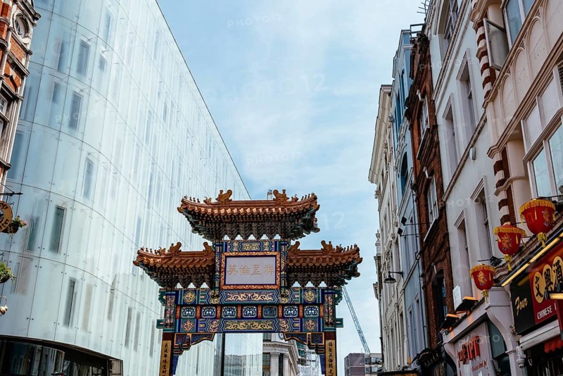London, UK, May 15, 2019: View of the entrance to London Chinatown with Chinese restaurants, bakeries and souvenir shops in Soho area