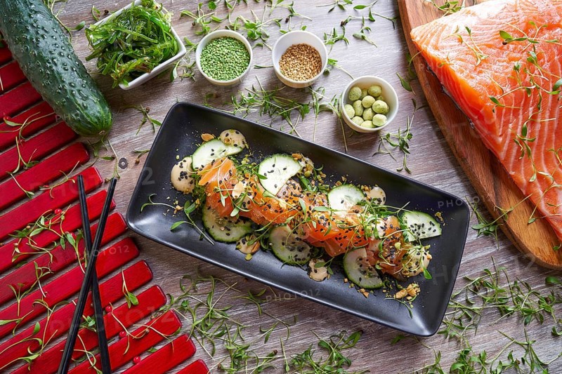 Wakame algae salad with salmon wasabi sesame and sprouts