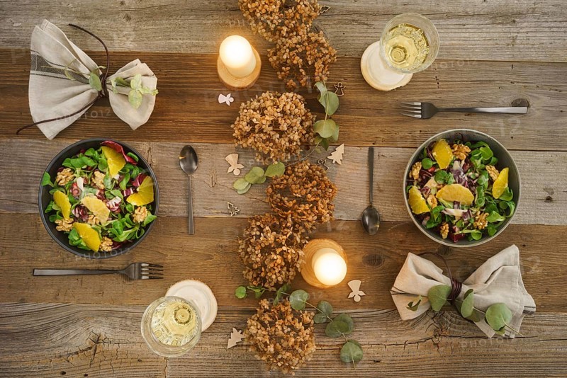 Christmas menu with salad with field salad, walnuts, orange fillets and radicchio