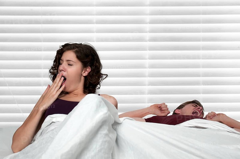 Young married couple waking upin the morning