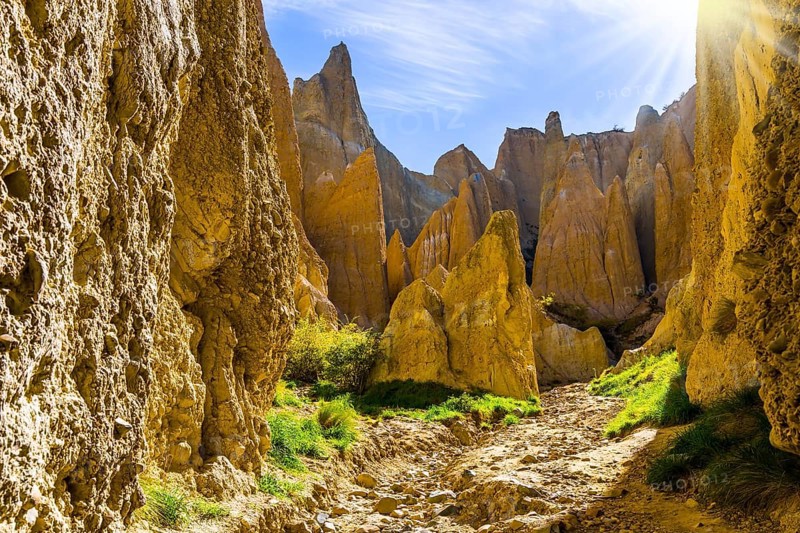 Ridges separated by narrow ravines. The Clay Cliffs are natural formations of land. Omarama, New Zealand, South Island. The concept of exotic, extreme, natural and photo tourism, Oceania