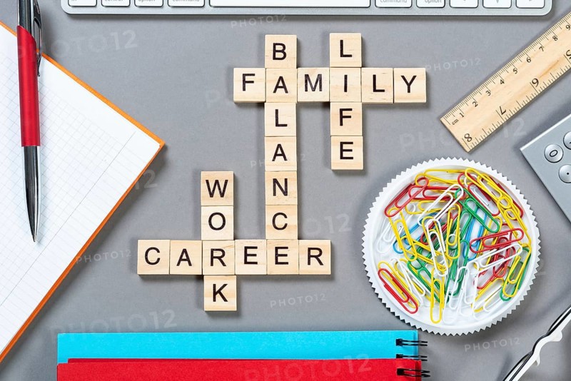 Business motivation concept with words from cubes. Still life of office workplace with crossword. Flat lay grey surface with notebook and stationery. Strategy planning and business analytics