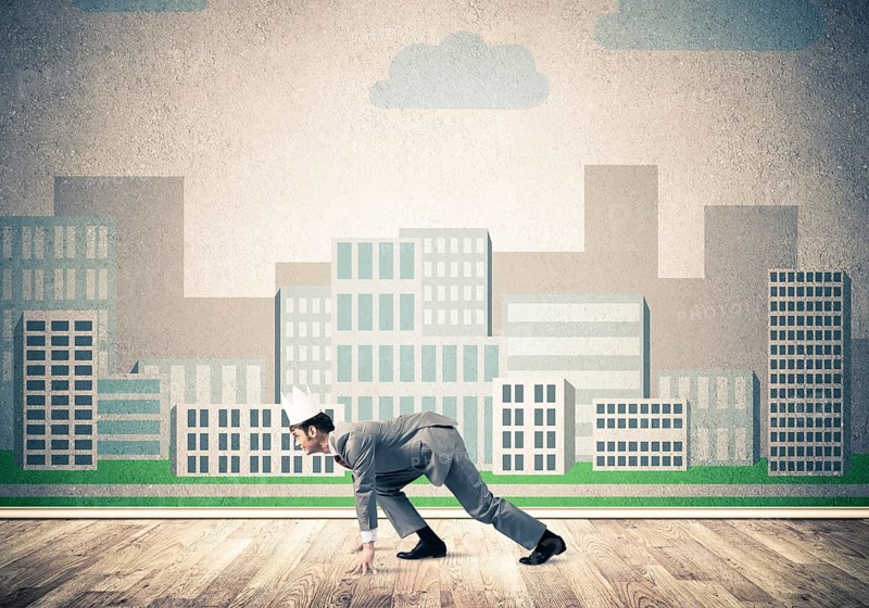 King businessman in elegant suit running and cityscape silhouette at background