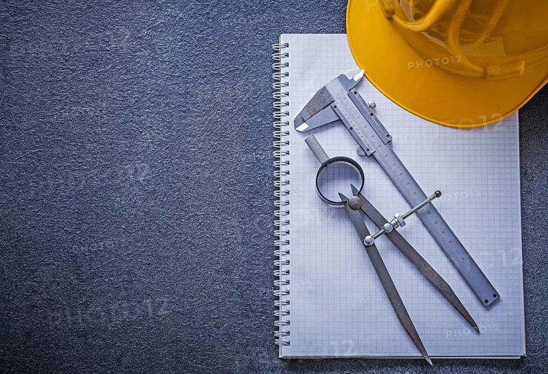 Notebook building helmet drawing compass slide caliper construction concept