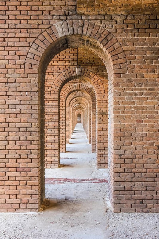 A series of brick arches inside Fort Jefferson. Fort Jefferson is a military historical fortress in the Dry Tortugas National Park, Florida