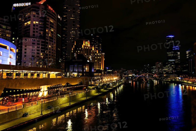 Central melbourne city river side modern urban skyline at night in australia