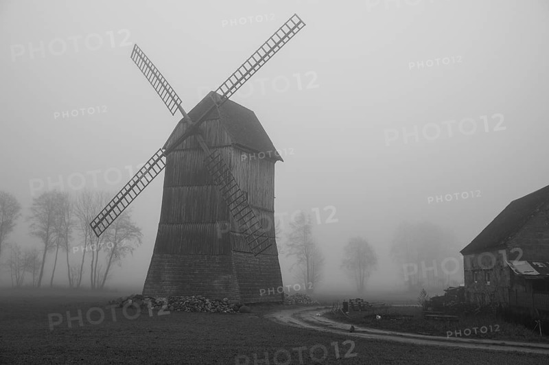 Kozlak windmill in the fog in Boruja Koscielna, Poland, Europe