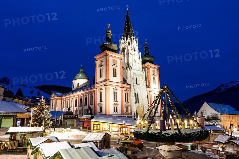 Advent atmosphere, world's largest hanging Advent wreath at the Christmas market in front of the basilica of Mariazell, blue hour in the early morning, Mariazell, Styria, Austria, Europe
