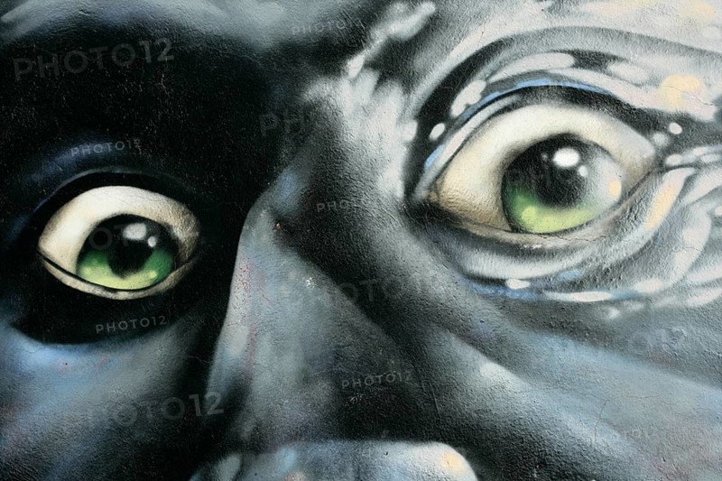 Portrait of angry man, graffiti over concrete, red, gray, green