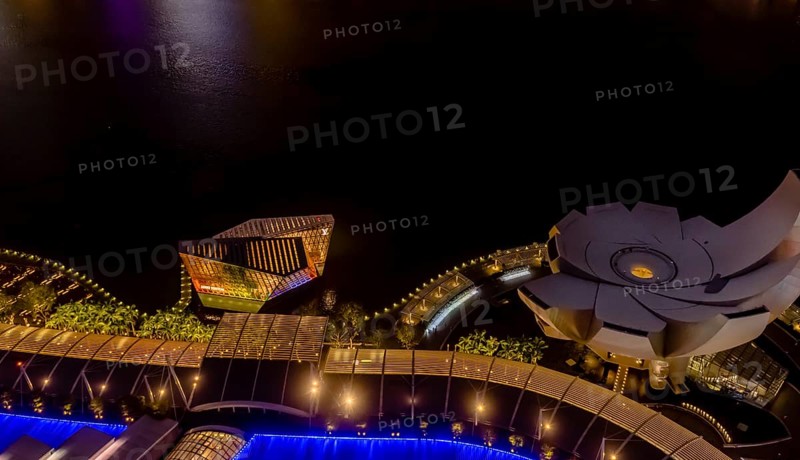 Singapore City, Singapore, January 23, 2019: Night aerial view of ArtScience Museum and Louis Vuitton building at Marina Bay, Asia