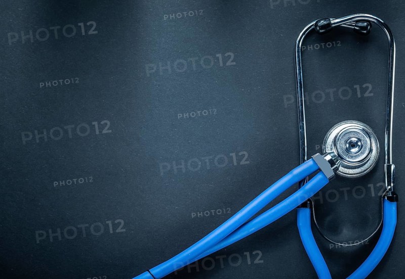 Stethoscope on black background top view medicine concept