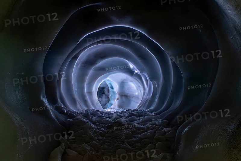 HINTERTUX, AUSTRIA, SEPTEMBER 10, 2023, A narrow path in a natural glacial ice cave