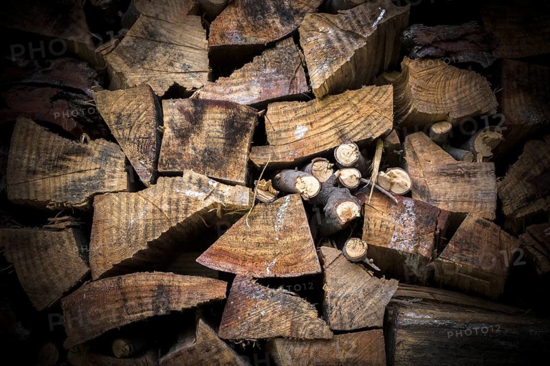 Lumber of various sizes stacked as a spare for the winter