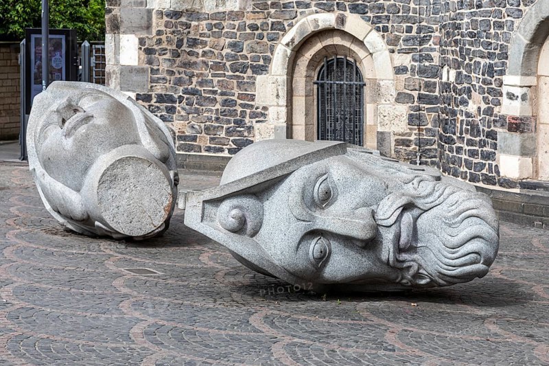 Heads of Bonn's patron saints Cassius and Florentus in front of Bonn Minster - Bonn, North Rhine-Westphalia, Germany, Europe