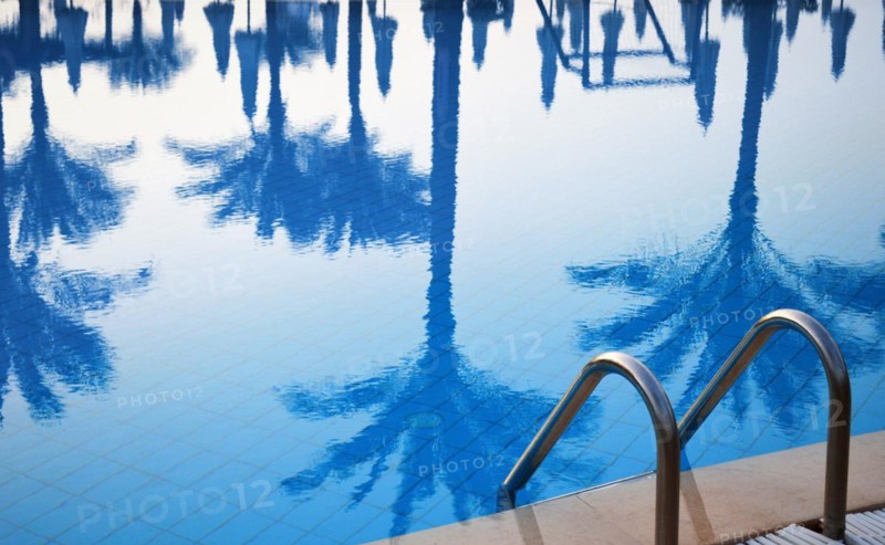 Swimming pool in touristic resort during summer time