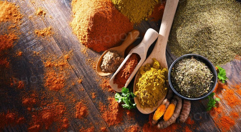 Composition with spices on wooden kitchen table