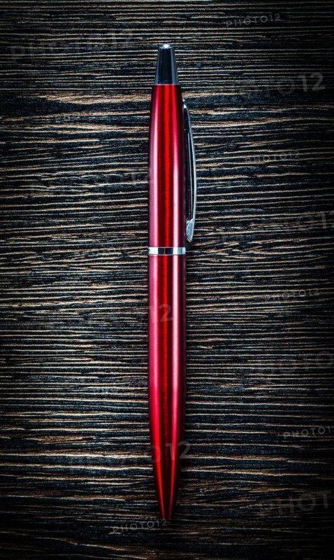Red biro pen on vintage wooden board