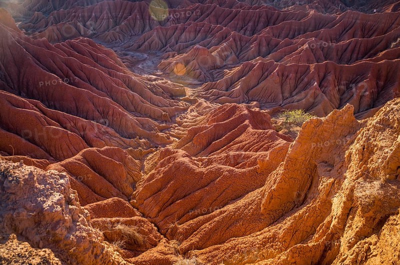Red hills of Tatacoa Desert bathed in sunlight in Huila, Colombia, South America