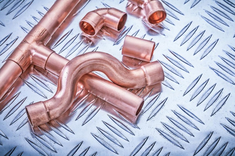 Copper pipe fixings on corrugated sheet metal Sanitary concept