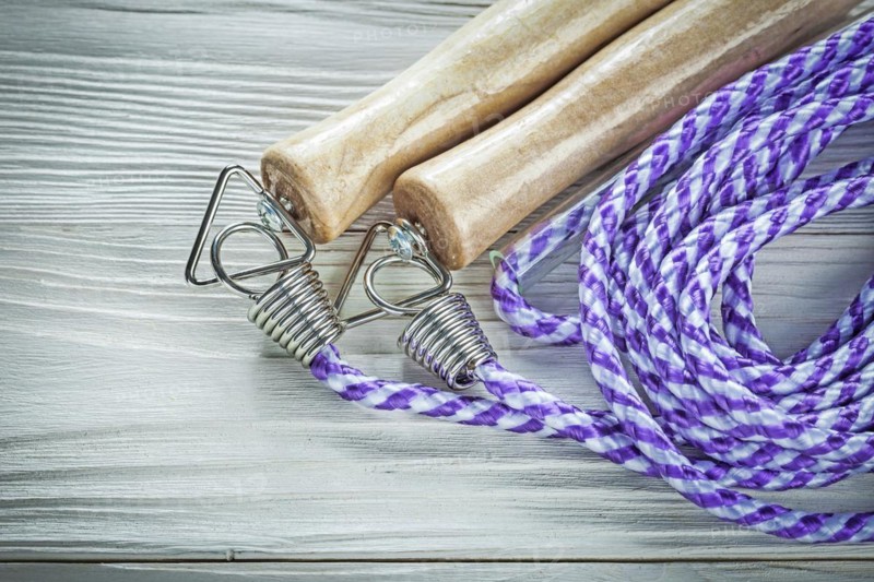 Skipping rope on wooden board Sports training concept