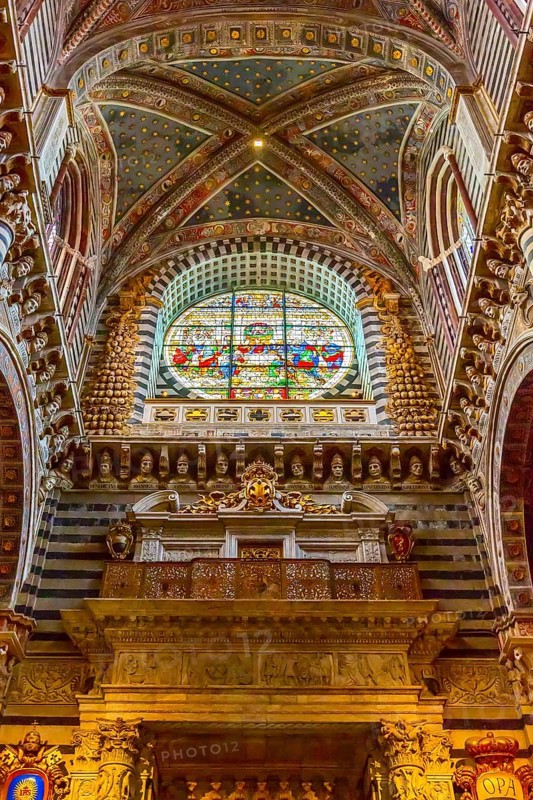 Siena Italy, October 25, 2018: Wall, stained-glass window and ceiling decorations in Siena Cathedral Duomo