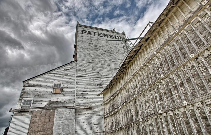 Prairie Grain Elevator in Saskatchewan Canada with storm clouds