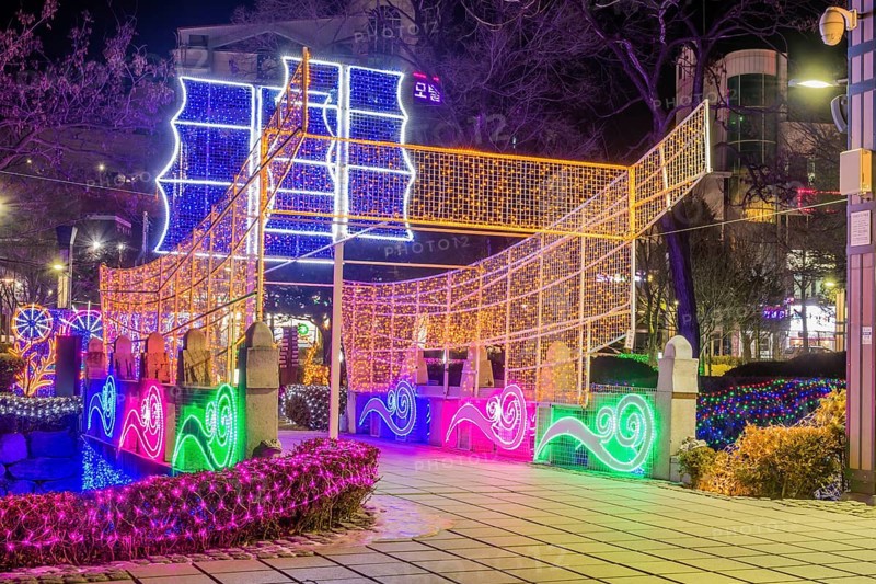 Taebeck, South Korea. January 29, 2019: Boat made of lights constructed on bridge over downtown stream during winter festival