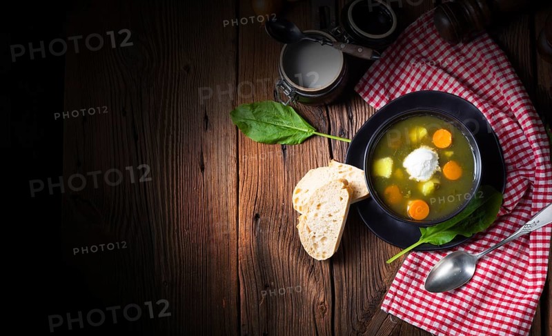 Rustic sorrel soup with potatoes and cream