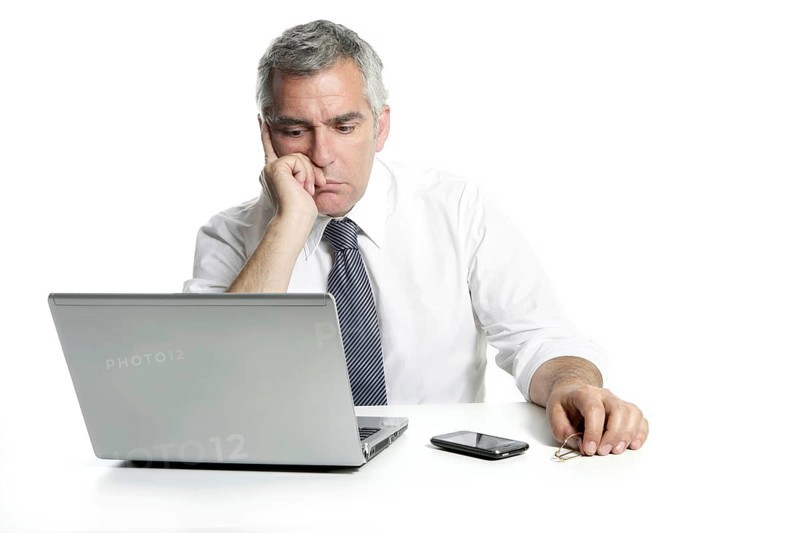 Businessman sad senior thinking laptop computer white background gray hair