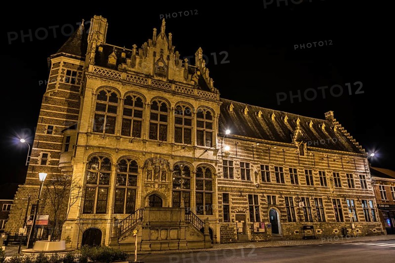 Zoutleeuw, Flanders, Belgium, 03 03 2019: View over the facade of the medieval Cloth Hall at the Old market square by night, Europe