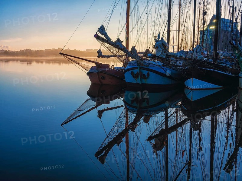 Sailing ships in the morning in the city harbour of Rostock