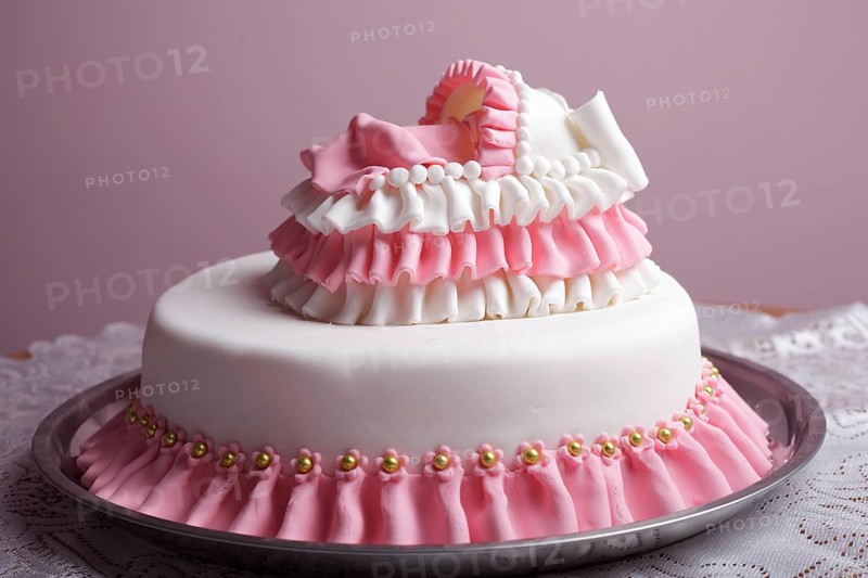 Birthday cake with mastic and little baby in bed
