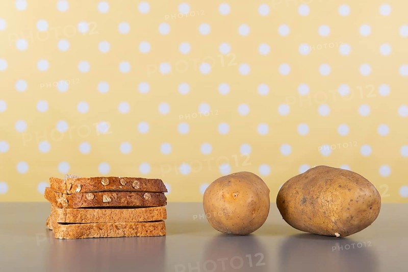 Bread and potatoes full of carbohydrates on the table
