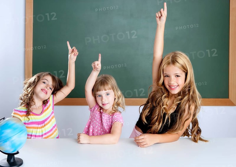 Kids student clever girls group in classroom raising hand finger