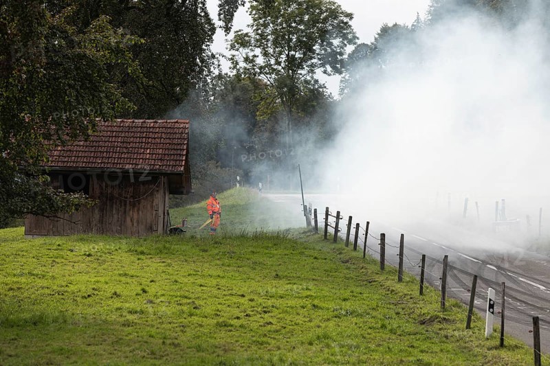 Track marshals in the fog at the 1st Malters hill climb in Malters, Lucerne, Switzerland, Europe