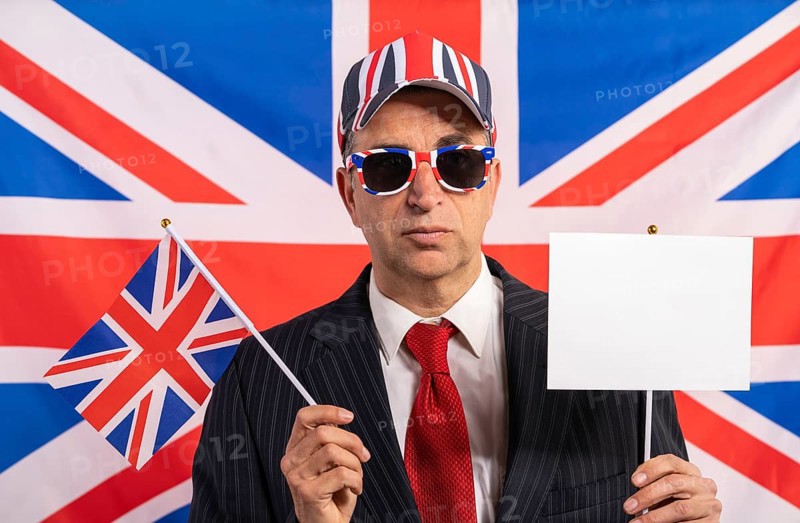 British male businessman with Brexit banner and UK flag