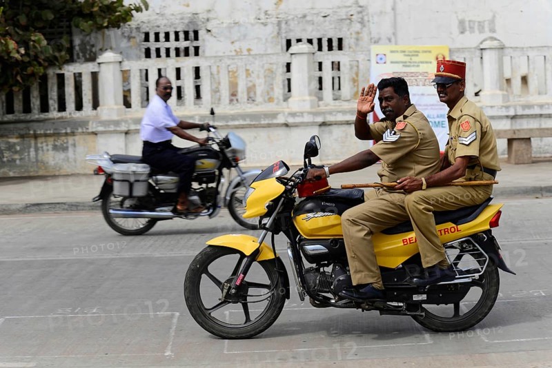 South India, Thanjavur, Madurai, Kovalam, Malabar Coast, Malabar, Kerala, Two policemen on a yellow motorbike riding on a road, Impressions from South India, Thanjavur, Madurai, Kovalam, Malabar Coast, Malabar, Kerala, South India, India, Asia