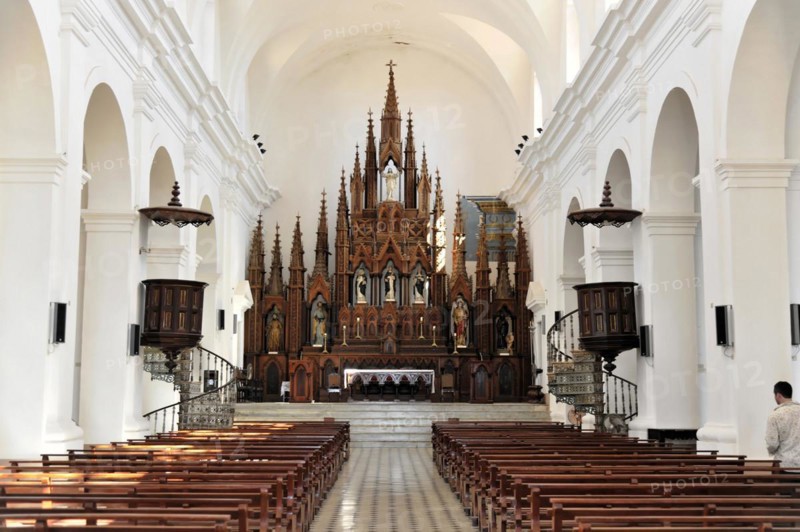 Interior of a church with Gothic altar and long pews for parishioners, Trinidad, Cuba, Central America