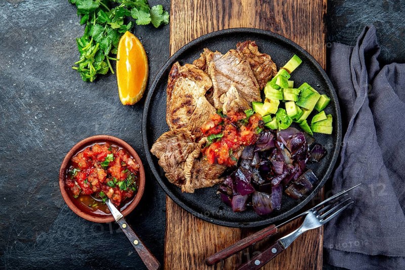 Food, Yucatan Mexican Food Pork POC CHUC poc chuck. Pork marinaded in orange juice served with avocado, purple onion and rustic tomato sauce