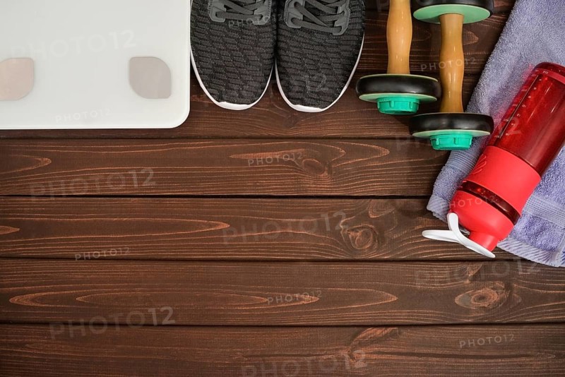 New life, sports paraphernalia on a wooden background, flat concept position