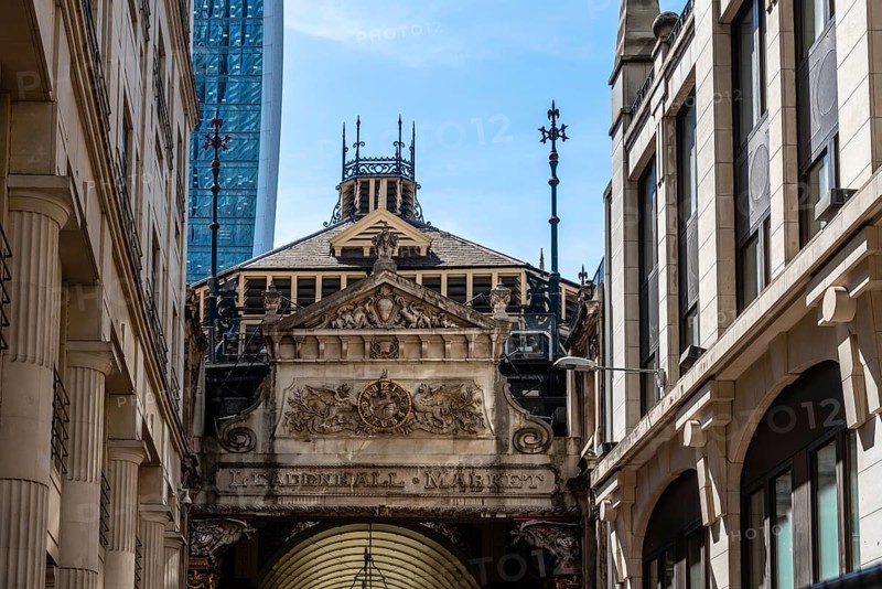 London, UK, May 14, 2019: Low angle view of the entrance to Leadenhall Market. Originally a meat, poultry and game market, it is now home to a number of boutique retailers, restaurants and cafes