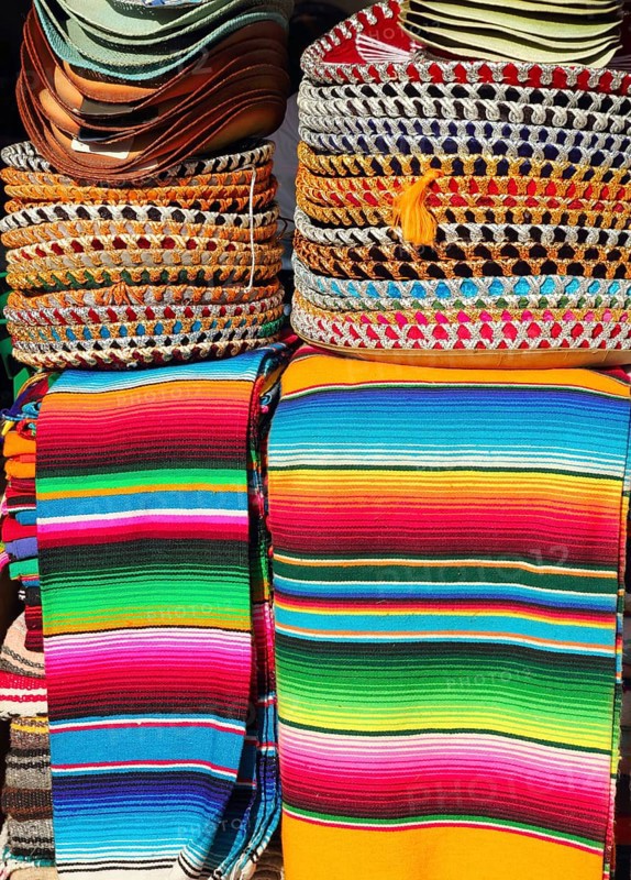 Mexican serape colorful stacked and charro hats mariachi
