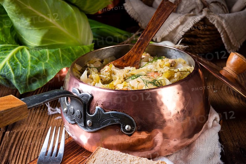 Young and fresh cabbage cooked with bacon cubes