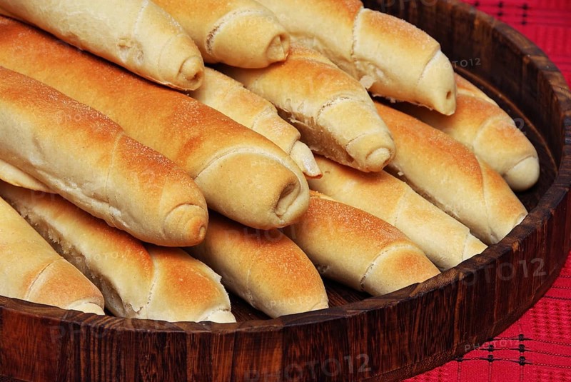 Heap of appetising homemade bread rolled loafs