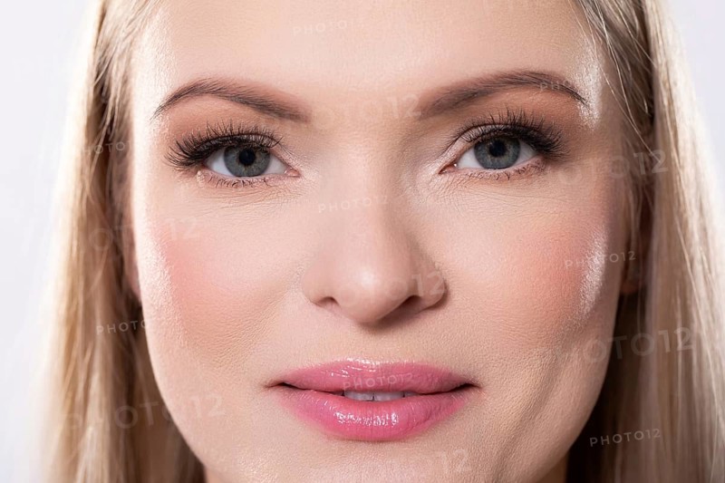 Closeup of an absolutely stunning woman displaying her radiant skin along with her pristine and striking features