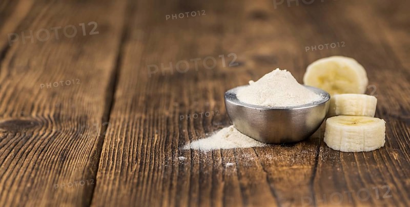 Banana Powder on rustic wooden background as close-up shot