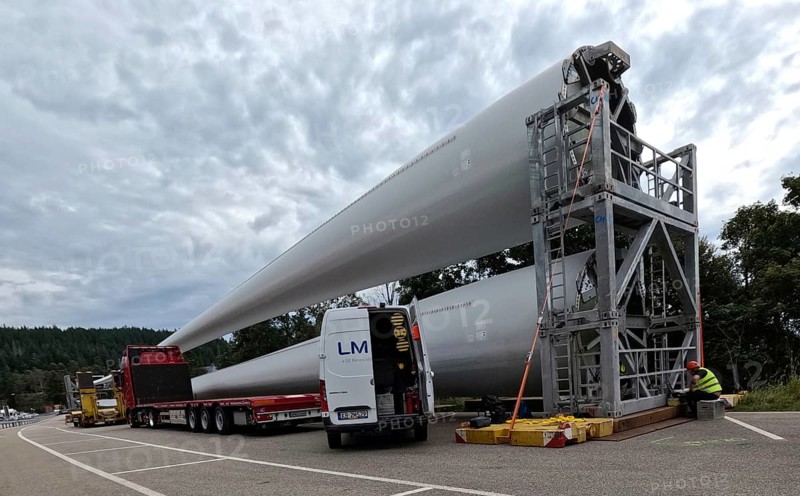 More rotor blades for the Schauinsland wind farm are ready for assembly at the car park on the Feldberg pass The heavy transport of the 68-metre-long rotor blades leads over the Feldberg (Breisgau-Hochschwarzwald district) to Freiburg's local mountain, the Schauinsland The rotor blades are mounted on a self-propelled vehicle and the journey to their destination takes several days at walking pace Themed picture Wind energy, Feldberg in the Black Forest, Germany, Europe