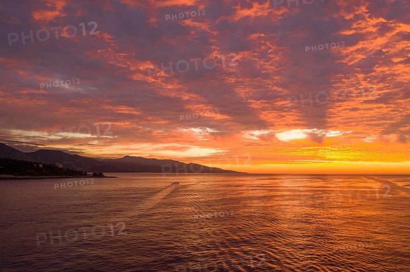 Aerial view of sunrise at Cap Martin, behind the Italian Ligurian coast, Roquebrune Cap Martin, Alpes Maritimes department, Provence-Alpes-Cote d'Azur region, France, Mediterranean Sea, Europe