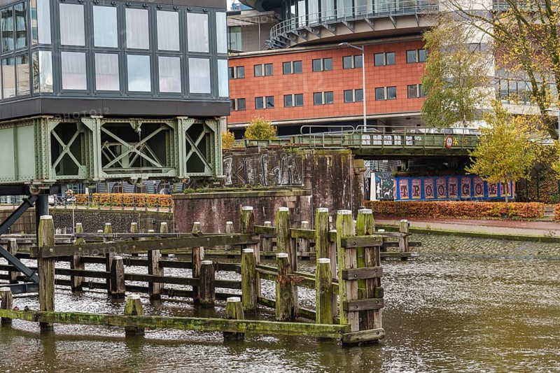 Old canal area with bridge and street art, autumn atmosphere, Amsterdam, Netherlands
